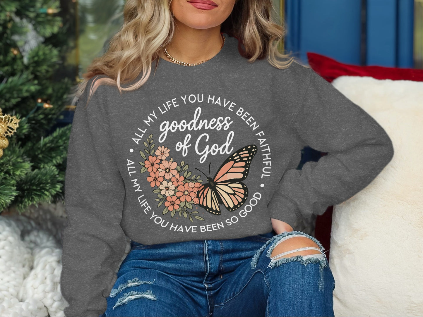 Gray sweatshirt with "goodness of God" and butterfly design.