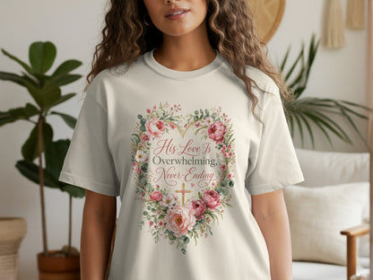 Cream t-shirt with a floral heart design and the text "His Love Is Overwhelming, Never-Ending".