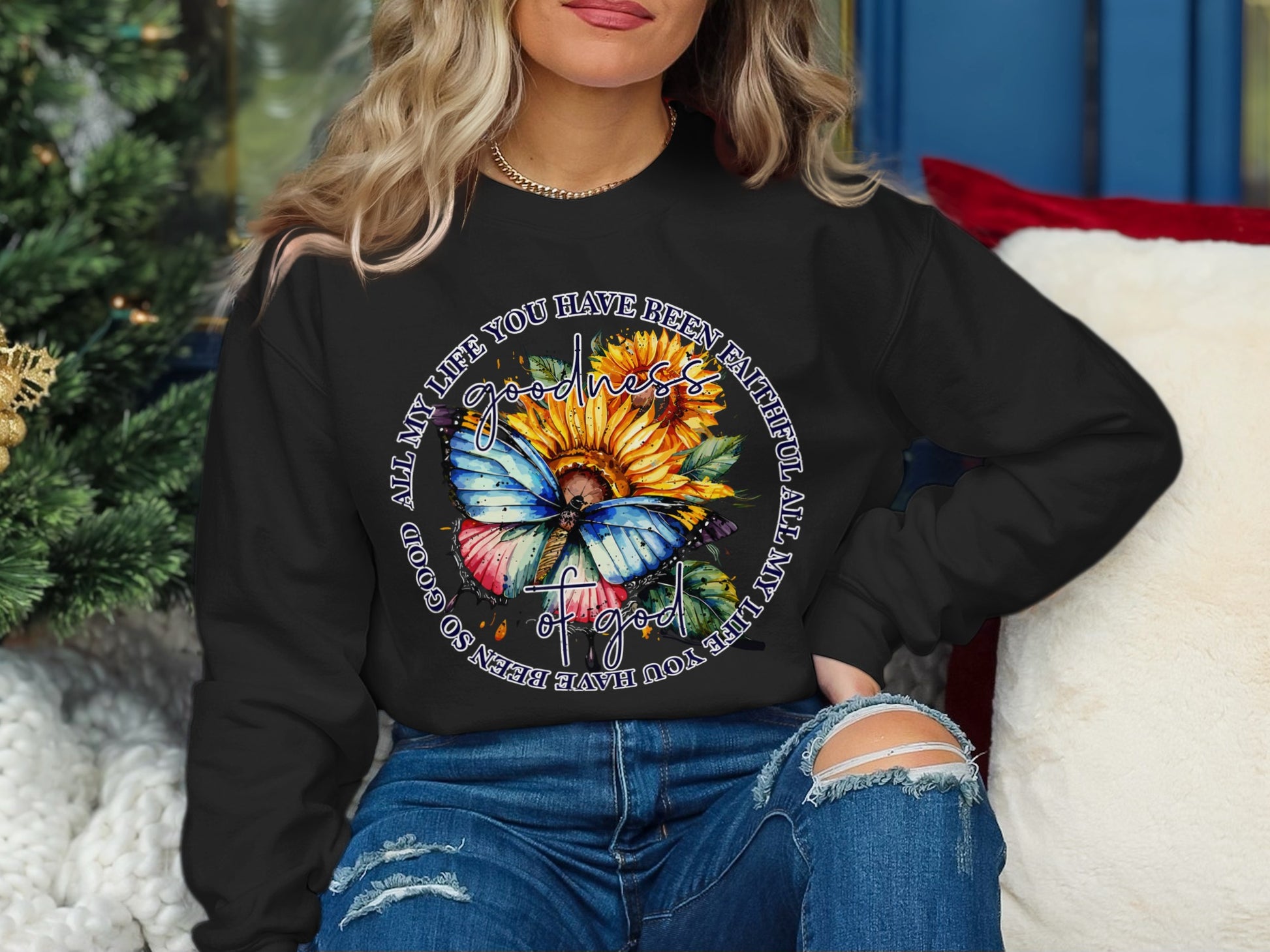 Black sweatshirt with sunflower, butterfly, and circular text: "ALL MY LIFE YOU HAVE BEEN SO GOOD ALL MY LIFE YOU HAVE BEEN FAITHFUL"