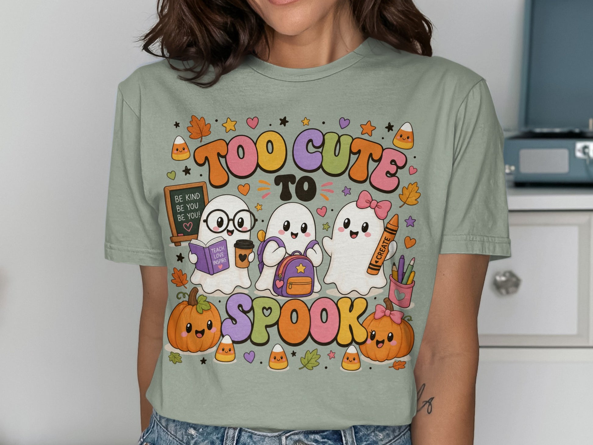 Three cute ghosts with pumpkins and candy corn say "Too Cute To Spook."