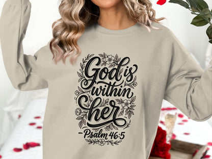 Cream sweatshirt with floral design and "God is within her" text.