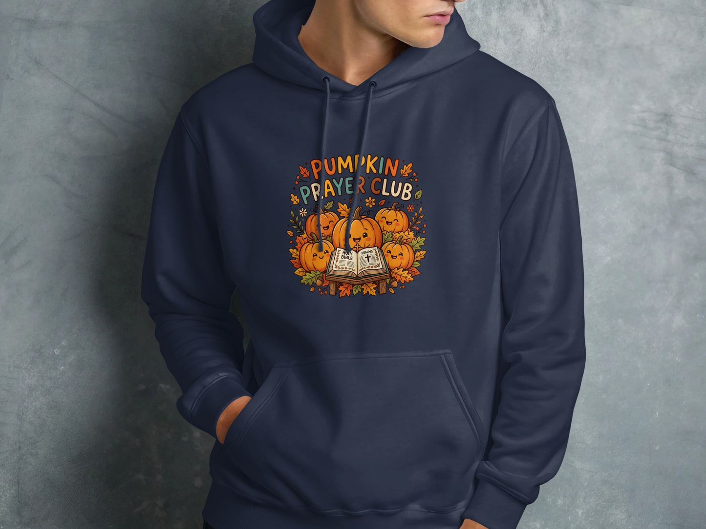Navy hoodie with "Pumpkin Prayer Club" text and smiling pumpkins.