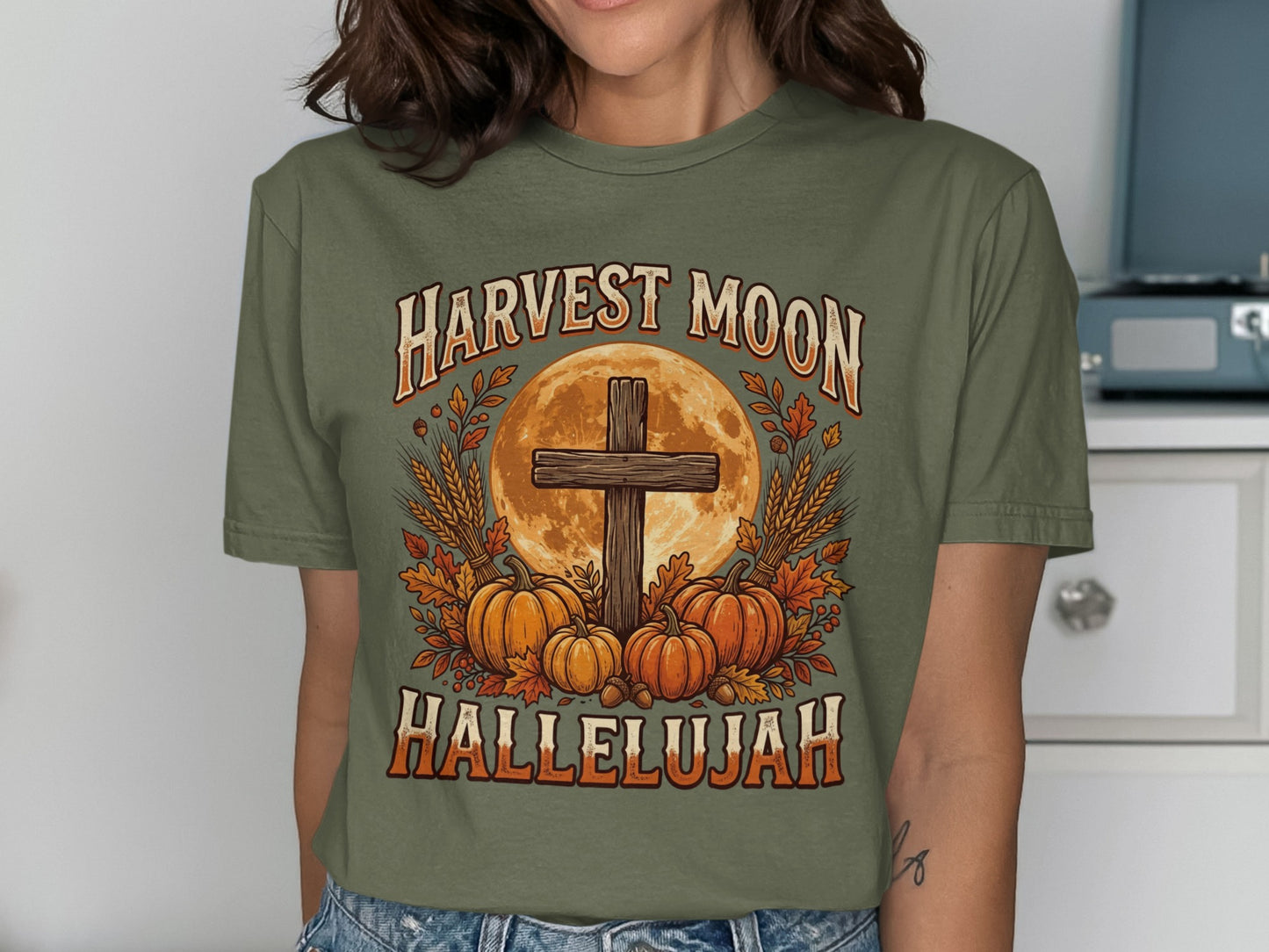 Harvest Moon Hallelujah text with cross, pumpkins, and wheat design.