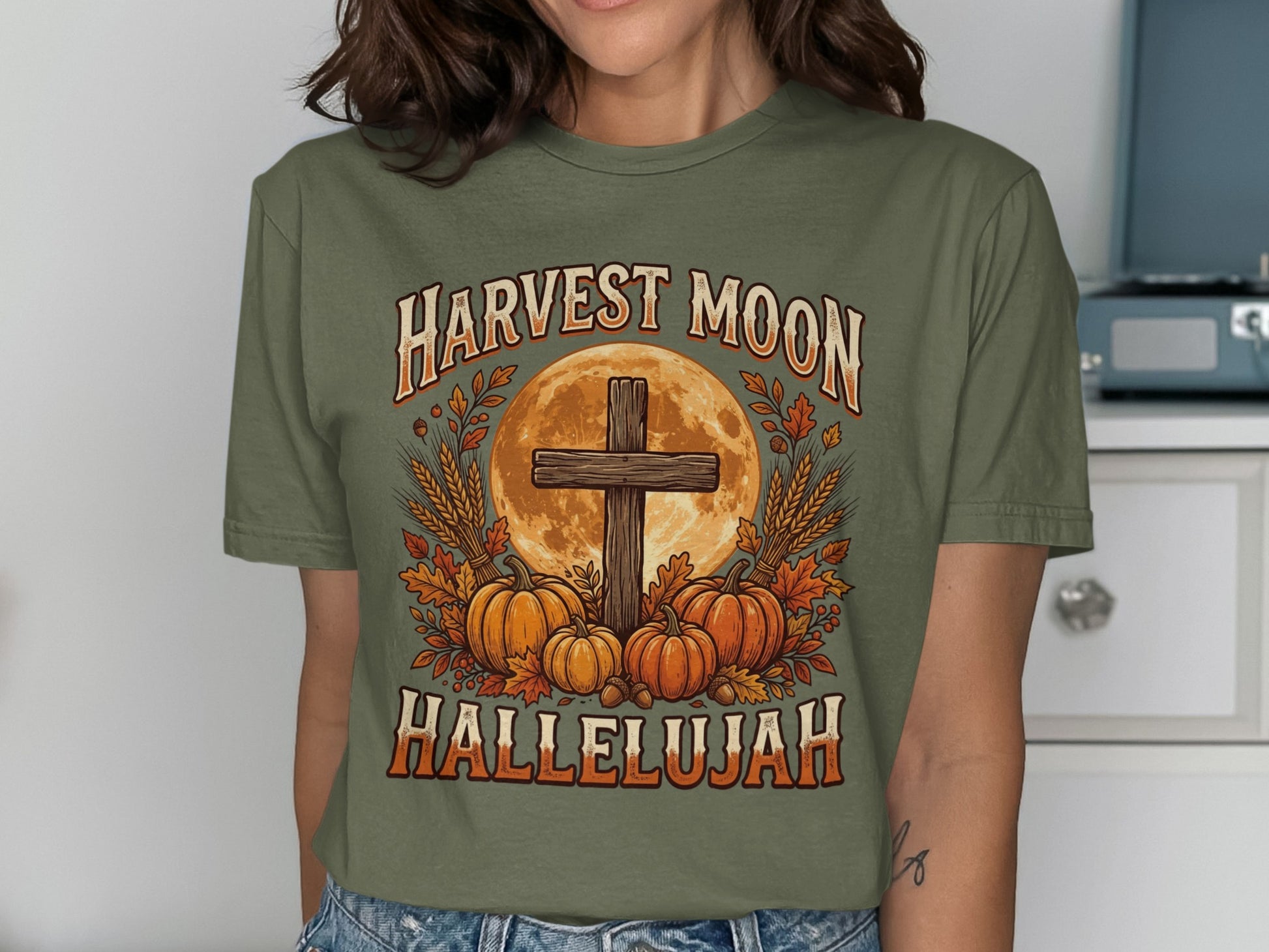 Harvest Moon Hallelujah text with cross, pumpkins, and wheat design.