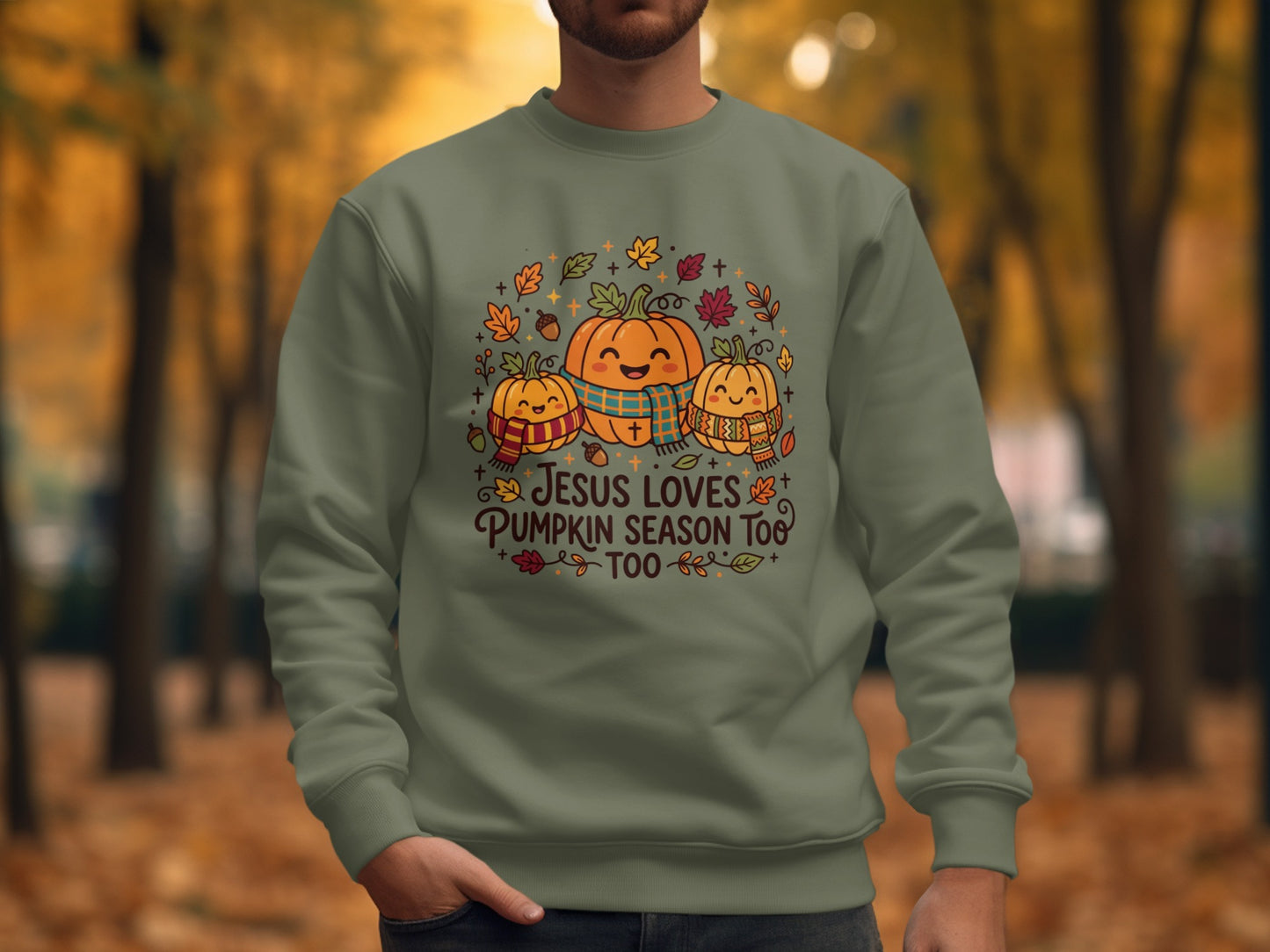 Green sweatshirt with pumpkins and "Jesus Loves Pumpkin Season Too" text.