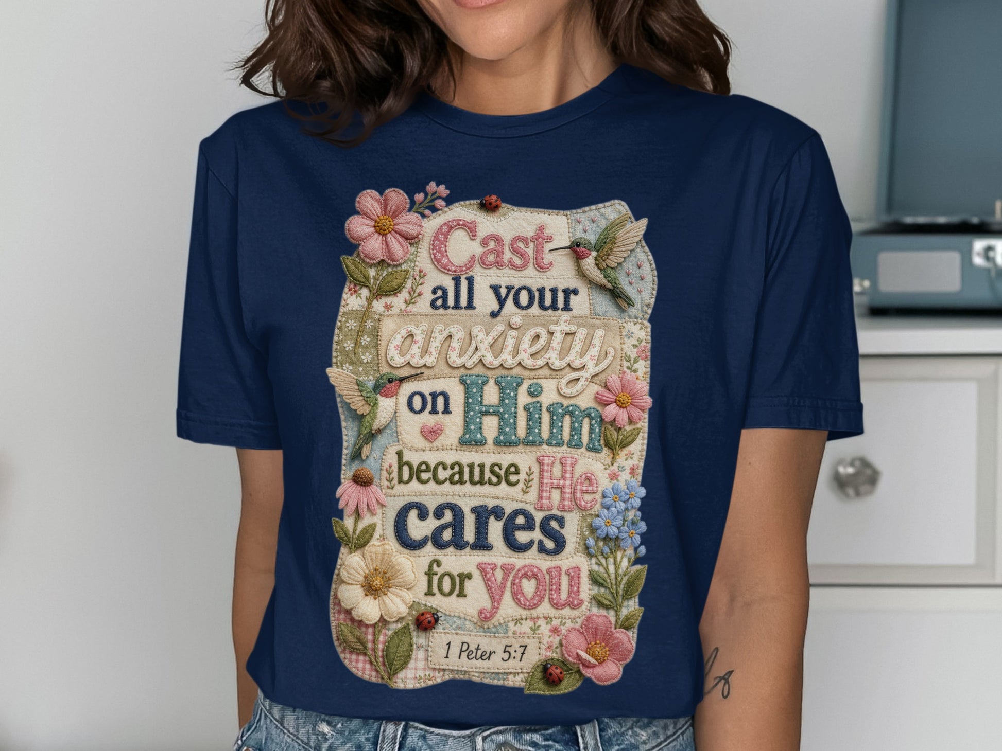 T-shirt with text "Cast all your anxiety on Him because He cares for you" and Bible verse 1 Peter 5:7.