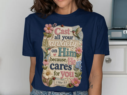 T-shirt with text "Cast all your anxiety on Him because He cares for you" and Bible verse 1 Peter 5:7.