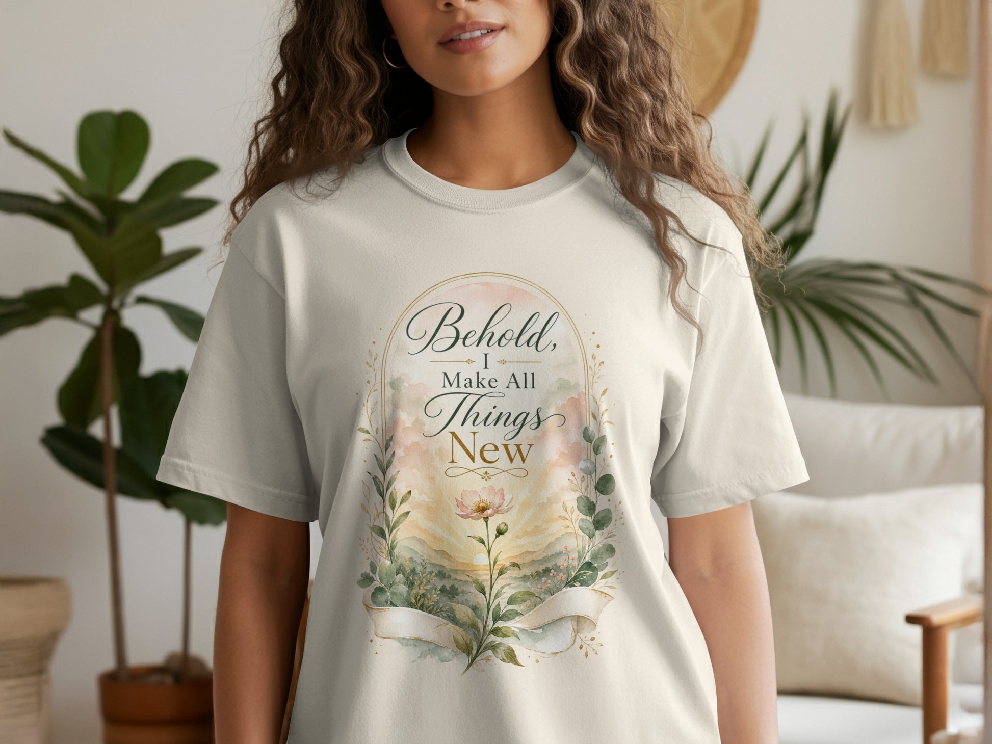 T-shirt with watercolor floral design and text "Behold, I make all things new".
