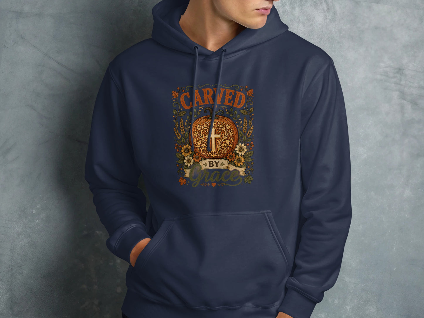 Navy blue hoodie with "Carved by Grace" text and a cross design.