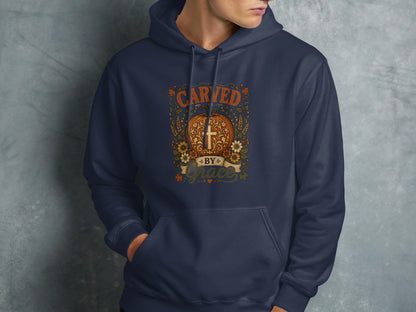 Navy blue hoodie with "Carved by Grace" text and a cross design.