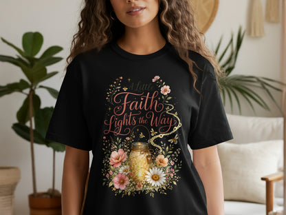 Black t-shirt with "A little Faith Lights the Way" text and floral design.