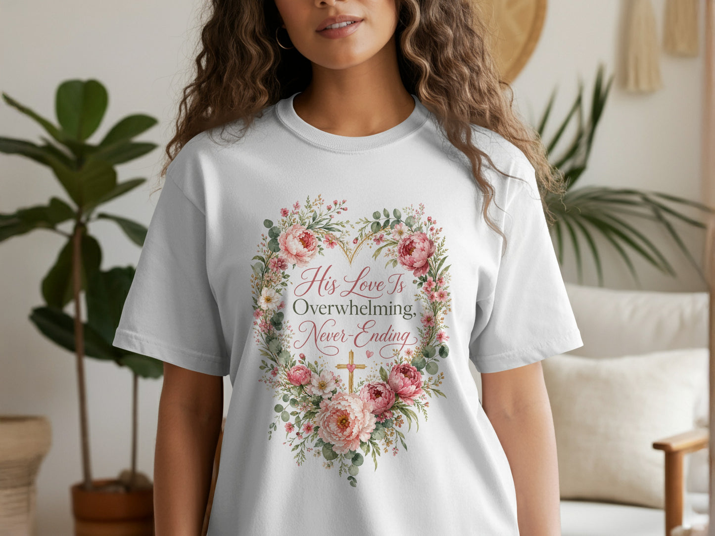 White t-shirt with floral heart design and text "His Love Is Overwhelming, Never-Ending".