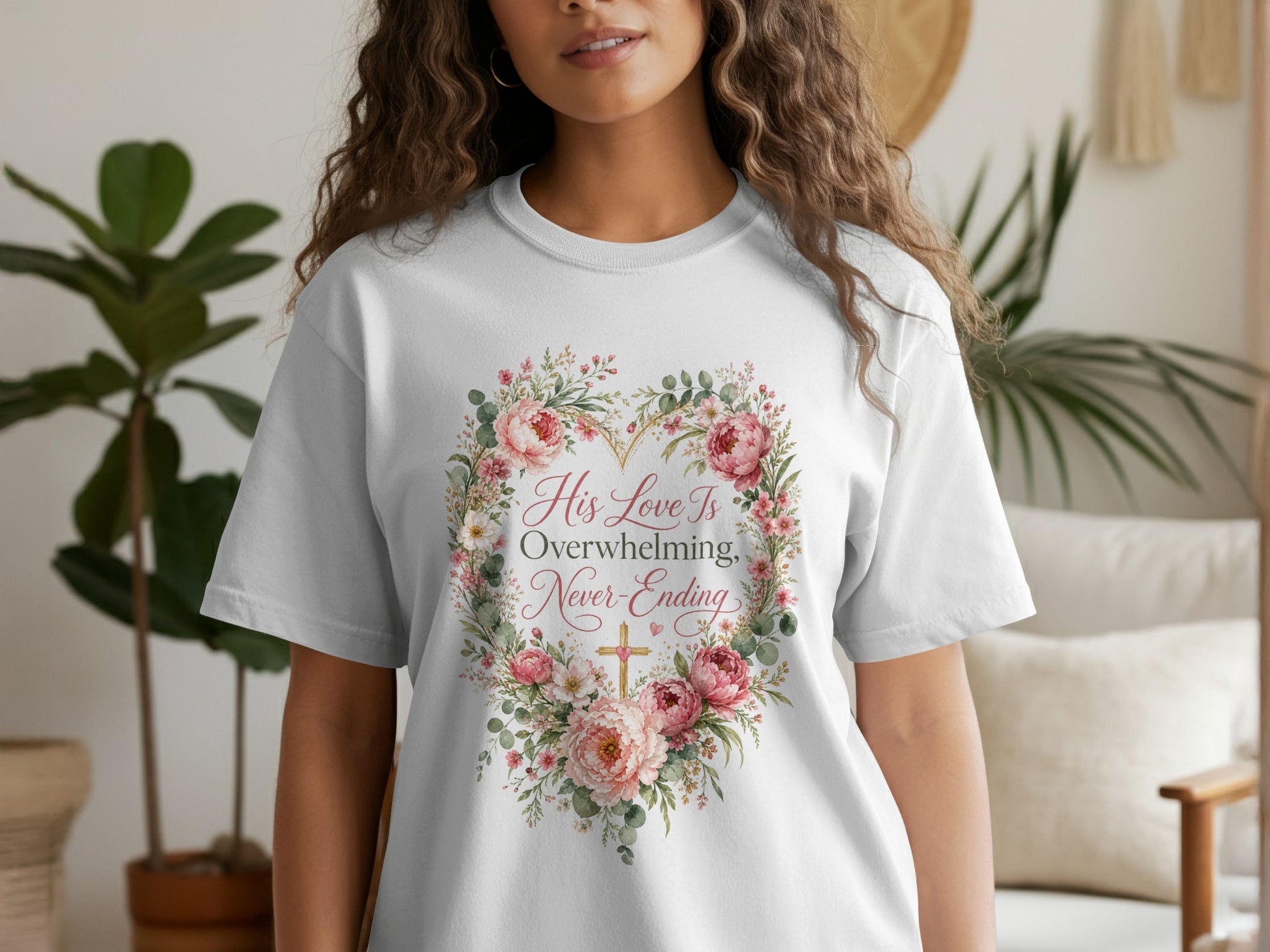 White t-shirt with floral heart design and text "His Love Is Overwhelming, Never-Ending".