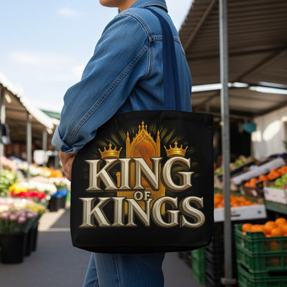 Black tote bag with gold crowns and text "KING OF KINGS" over a throne.