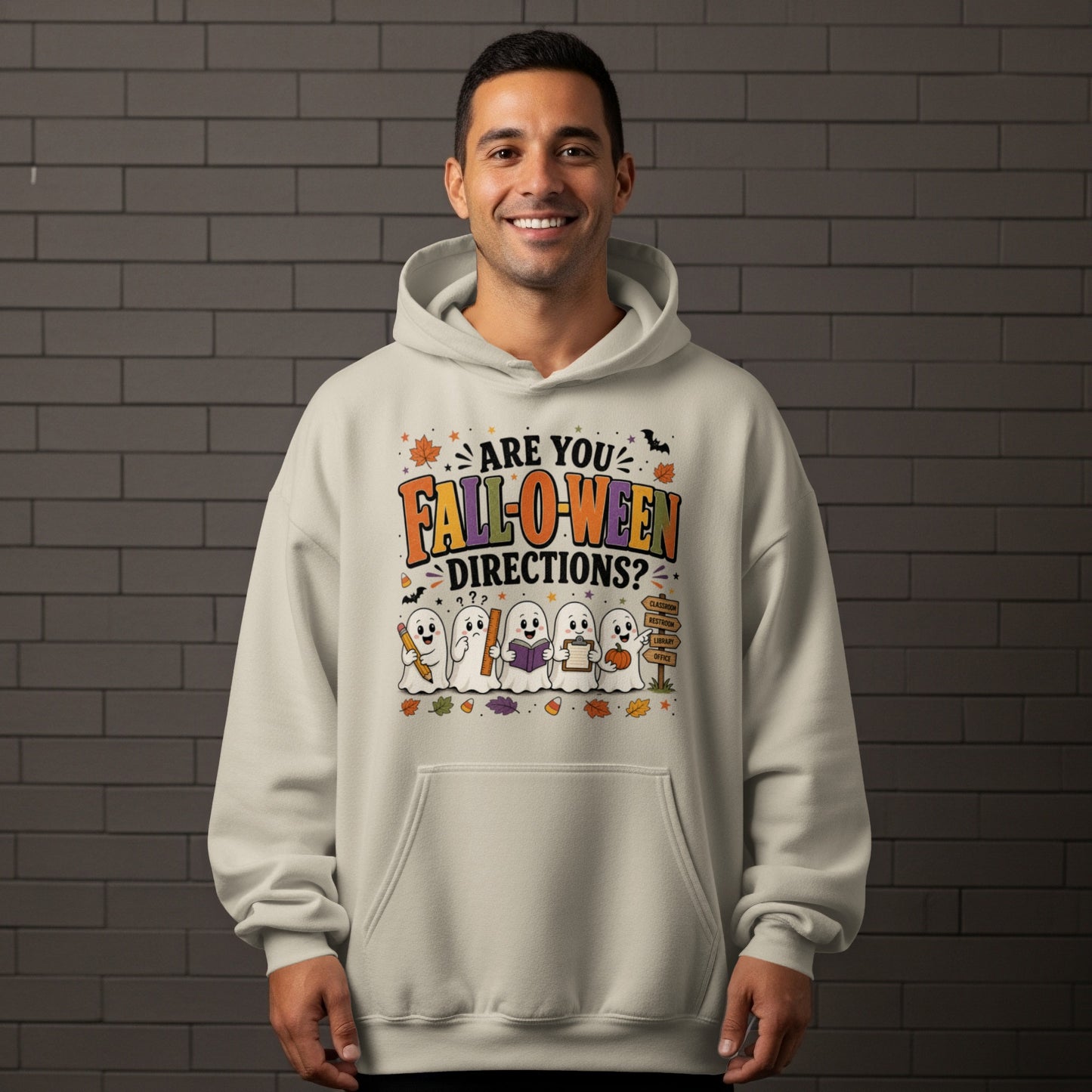 "Are you Fall-O-ween Directions?" text with ghosts holding school supplies on a hoodie.