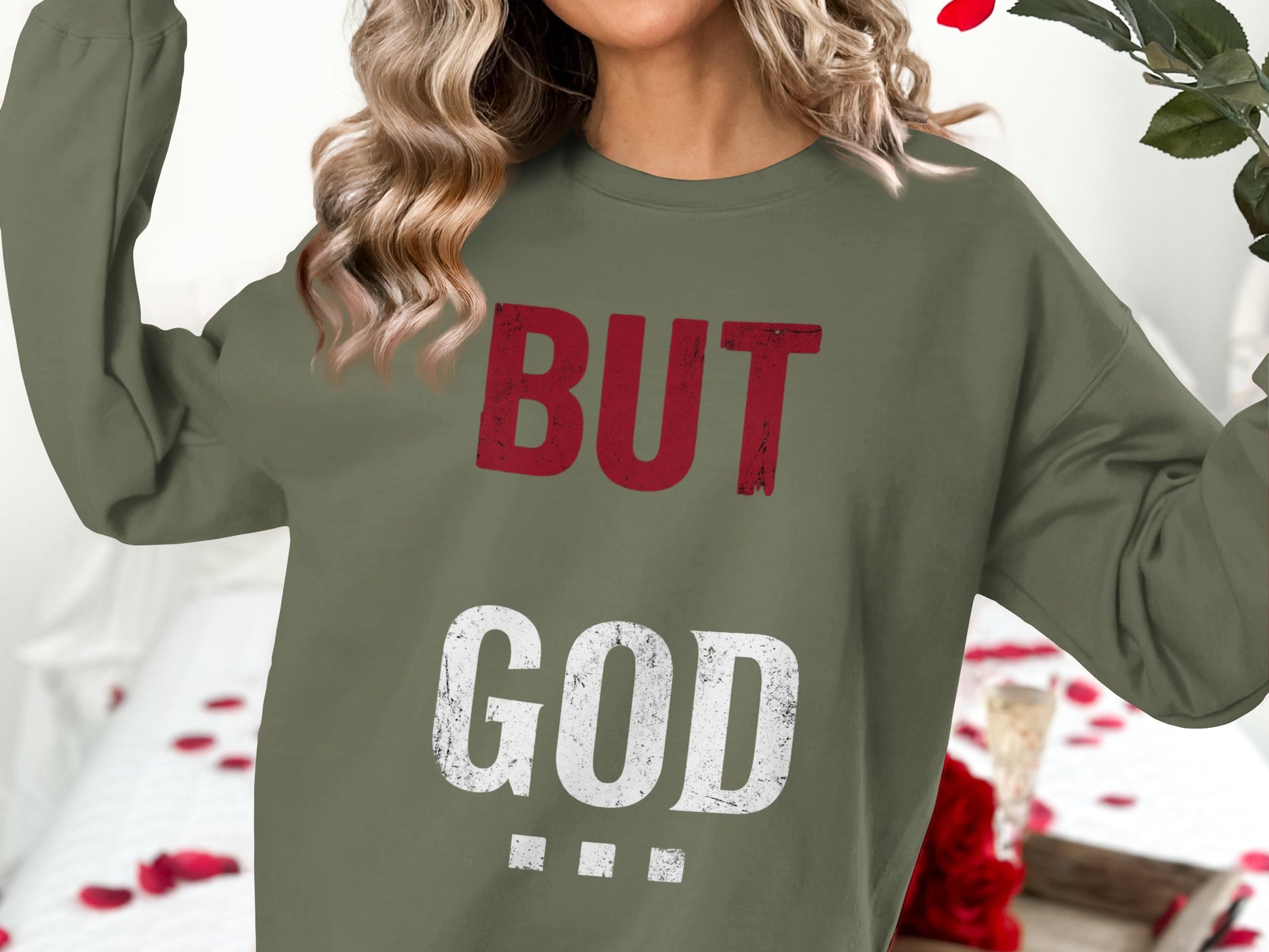 Olive sweatshirt with "BUT GOD" text in distressed red and white.