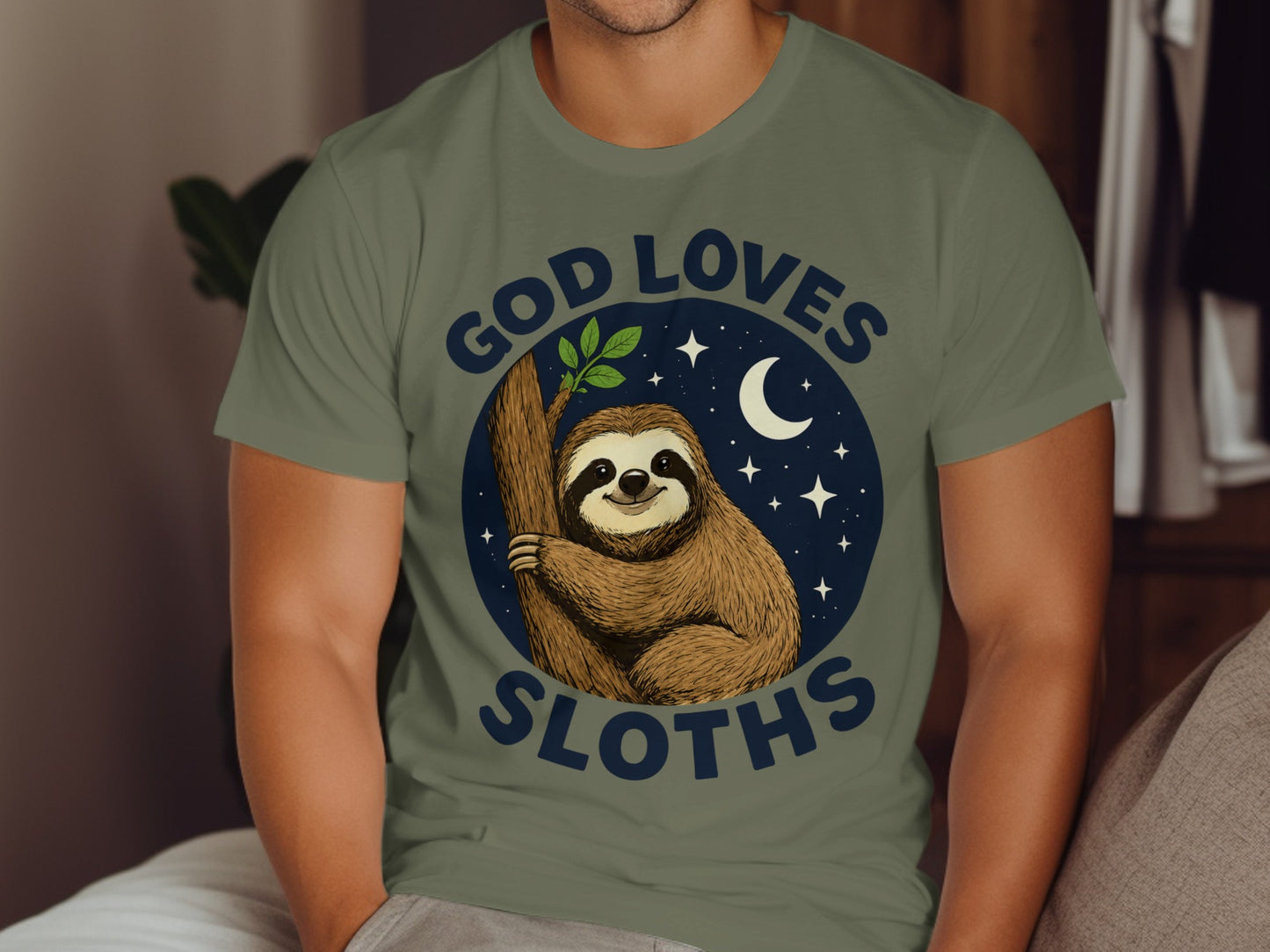 Sloth on a tree branch under a crescent moon and stars with text "God Loves Sloths".