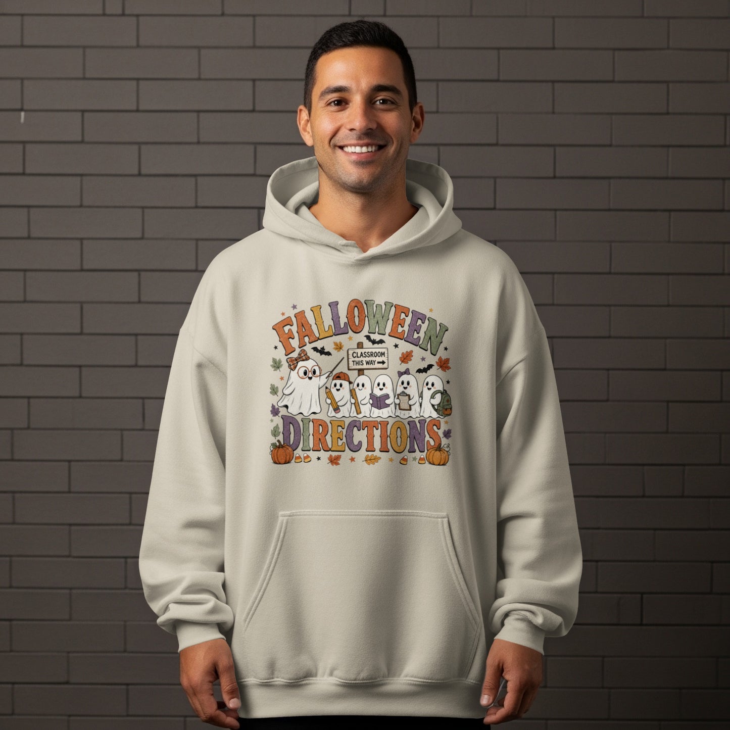 Cream hoodie with "Falloween Directions" graphic featuring cute ghosts and Halloween elements.
