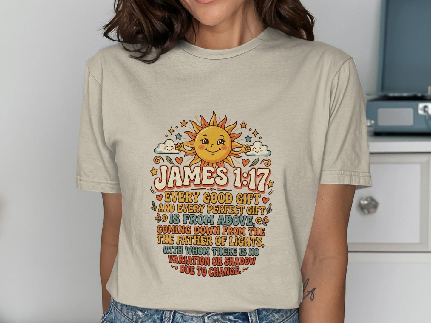 T-shirt with James 1:17 Bible verse and a cheerful sun illustration.