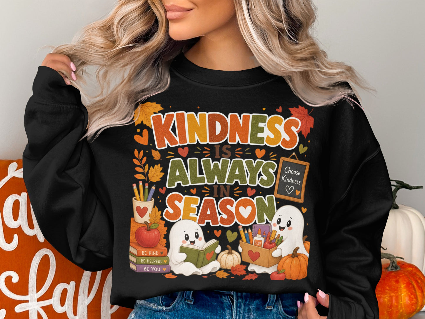 Black sweatshirt with "Kindness is Always in Season" graphic and cute ghosts.