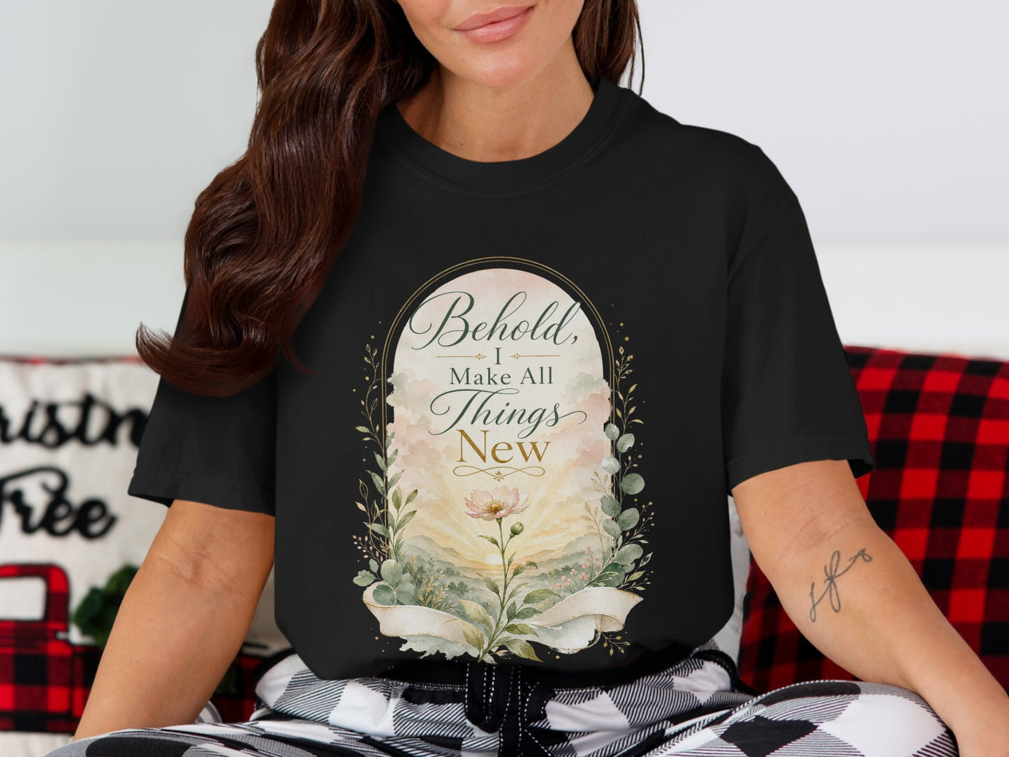 Black t-shirt with floral design and text "Behold, I Make All Things New".