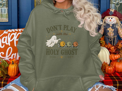 Hoodie with ghost and pumpkins saying "Don't Play with the Holy Ghost."