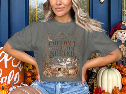 Grey t-shirt with Halloween Jesus text and desert tomb graphic.