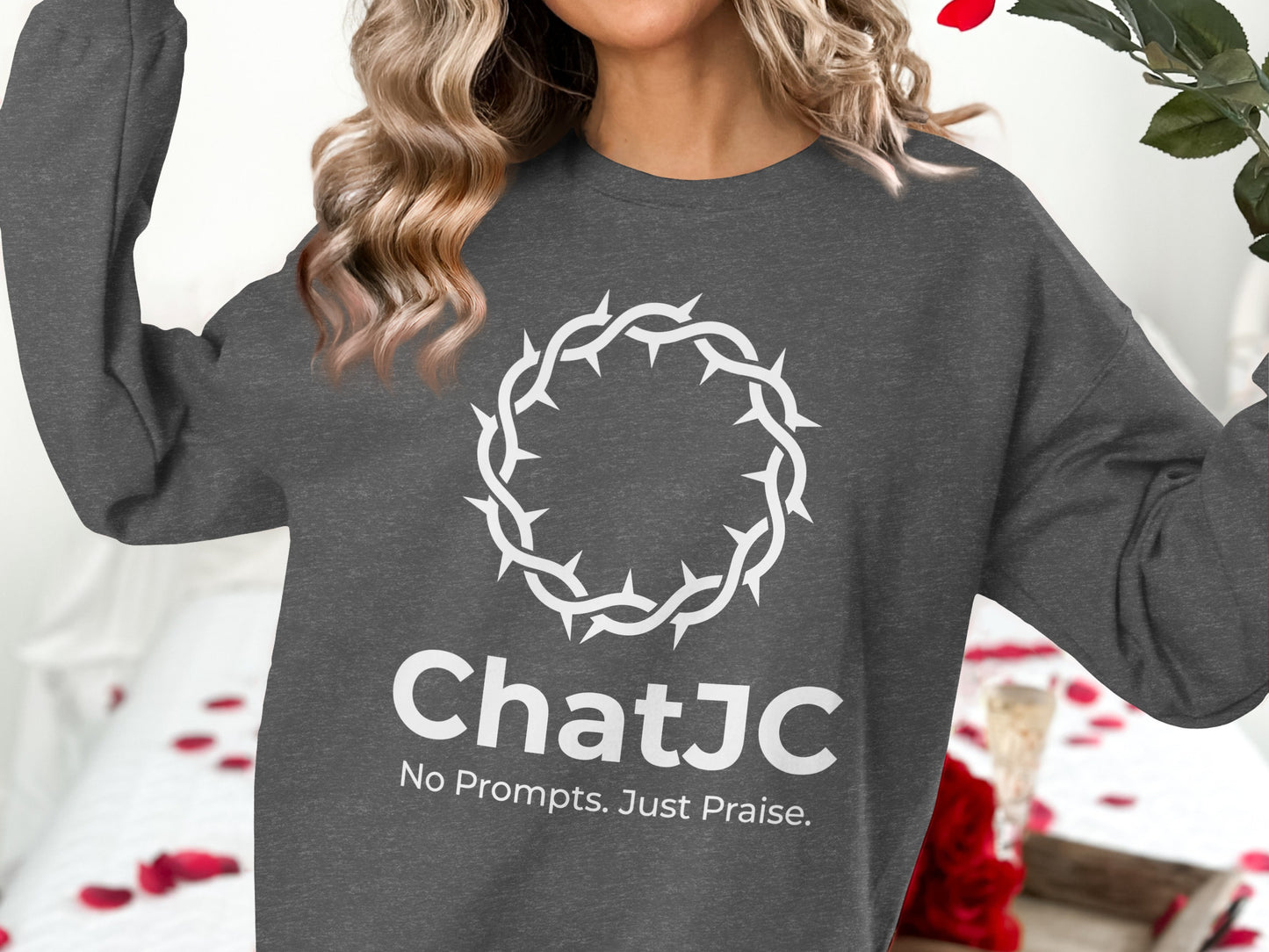 Dark grey sweatshirt with a white graphic of a crown of thorns and "ChatJC No Prompts. Just Praise."