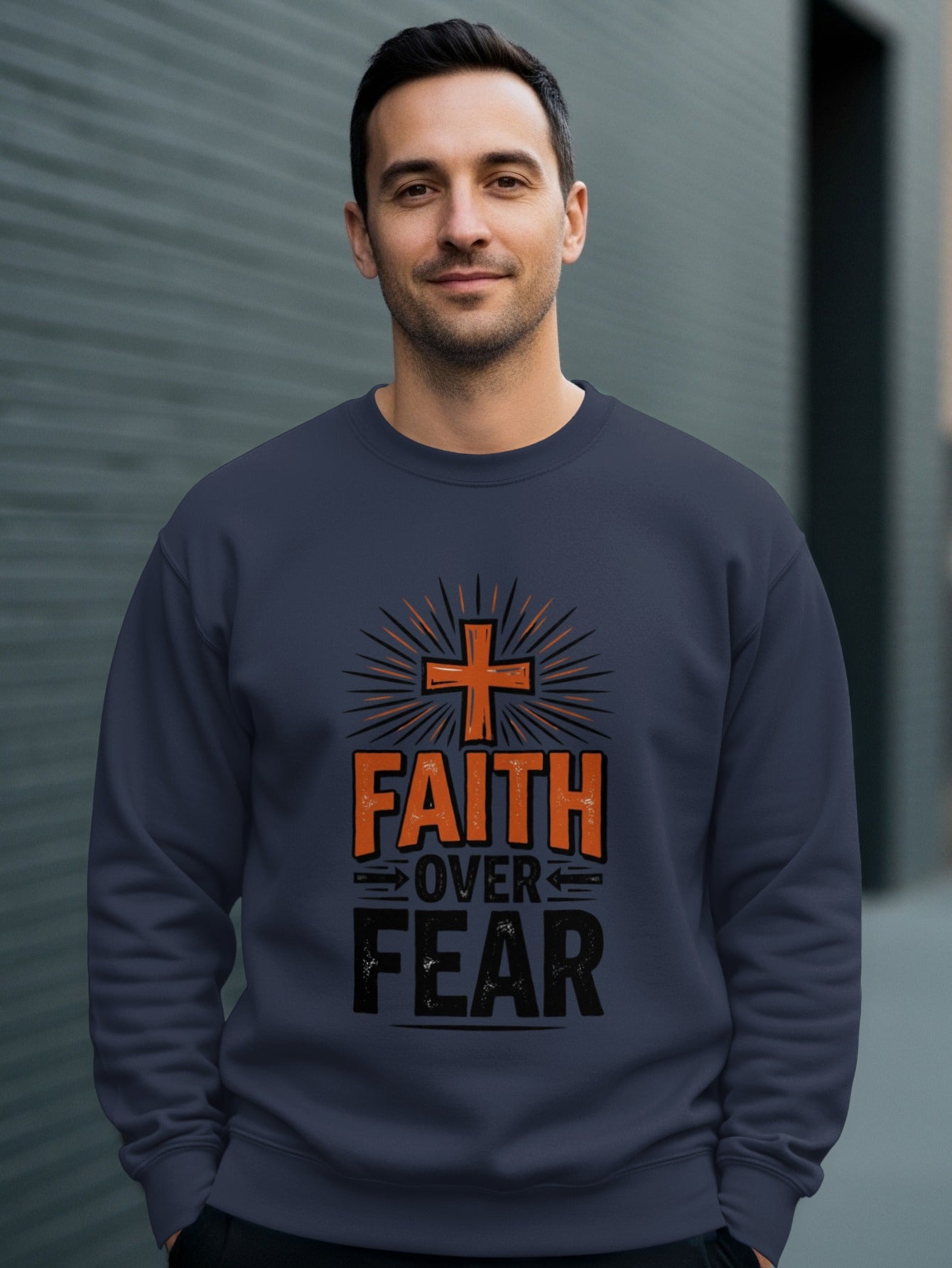 Dark blue sweatshirt with "Faith Over Fear" text and orange cross design.