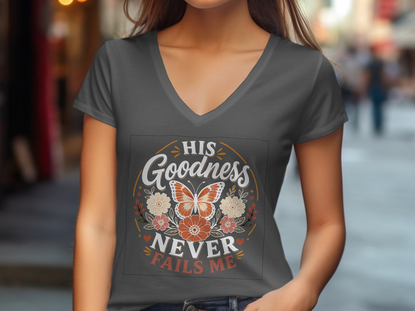 Dark grey v-neck t-shirt with "His Butterfly Never Fails Me" graphic.