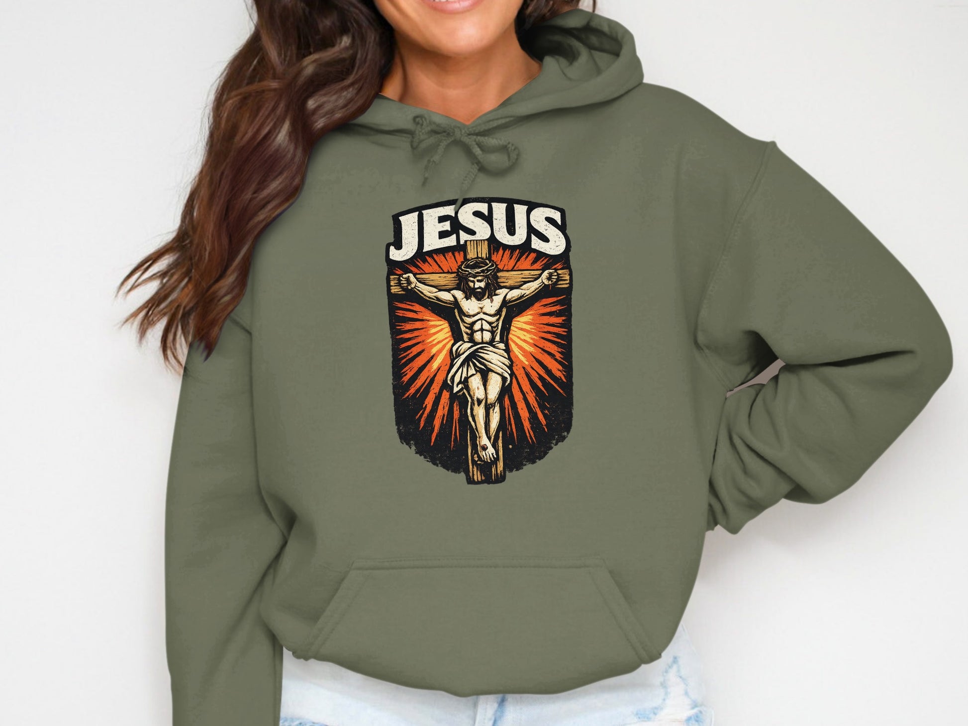 Jesus crucifixion graphic on olive green hoodie.