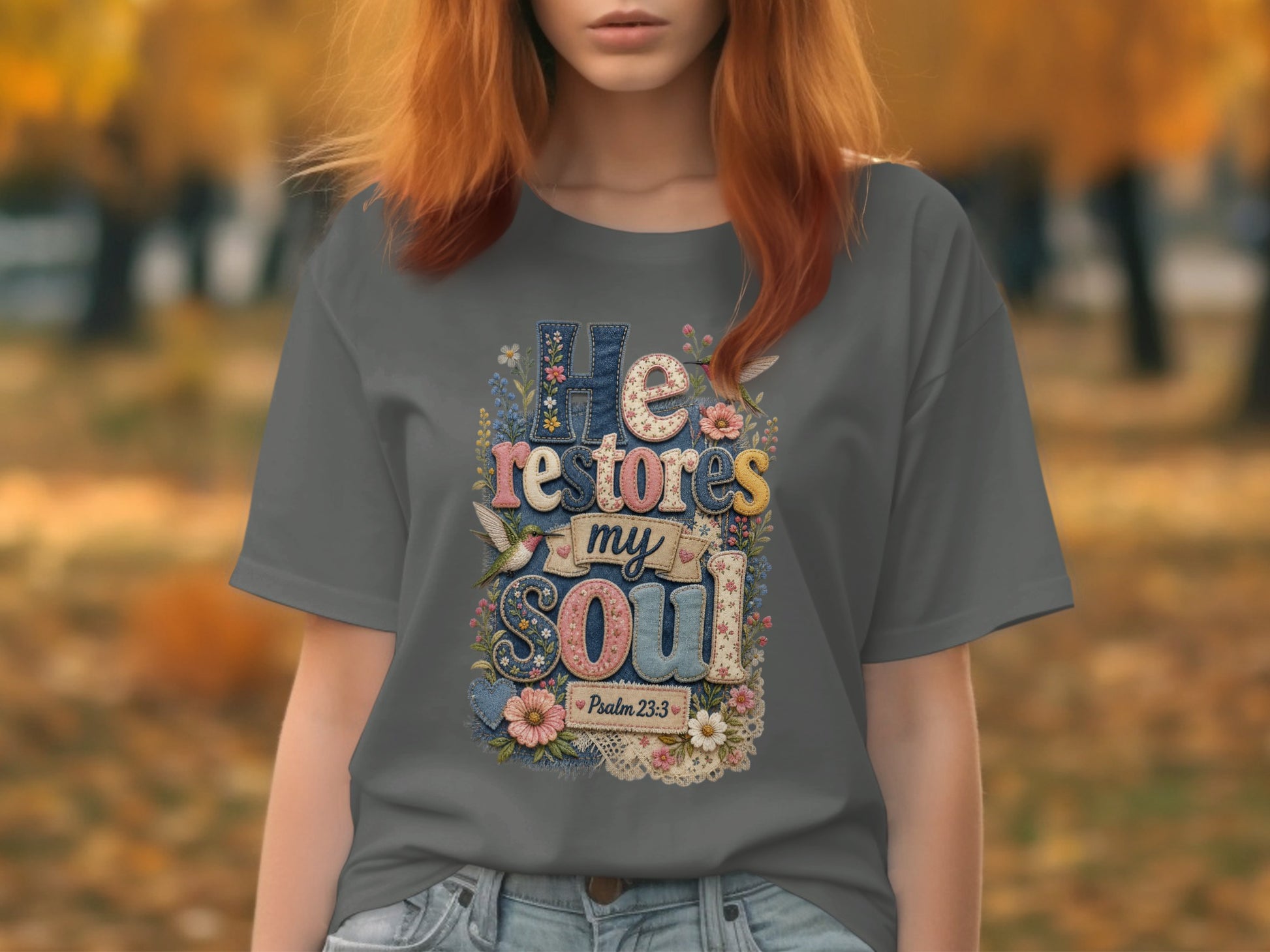 Gray t-shirt with "He restores my soul" floral text design.