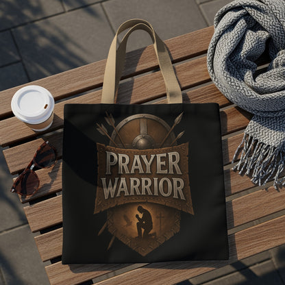 Tote bag with "PRAYER WARRIOR" text over a kneeling figure and shield.