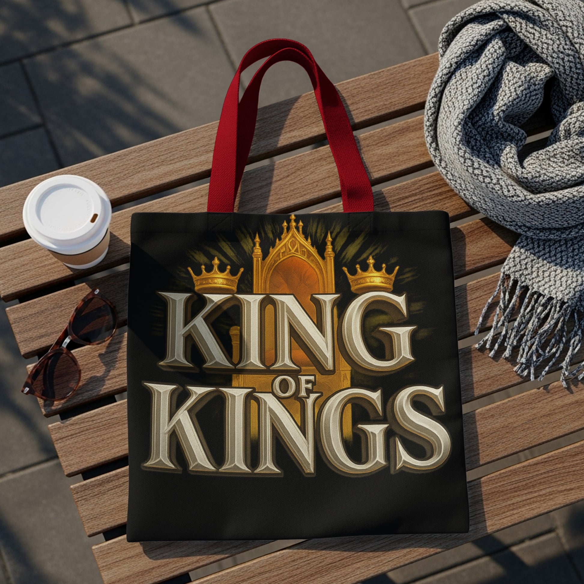 Black tote bag with "KING OF KINGS" text and crown graphic.
