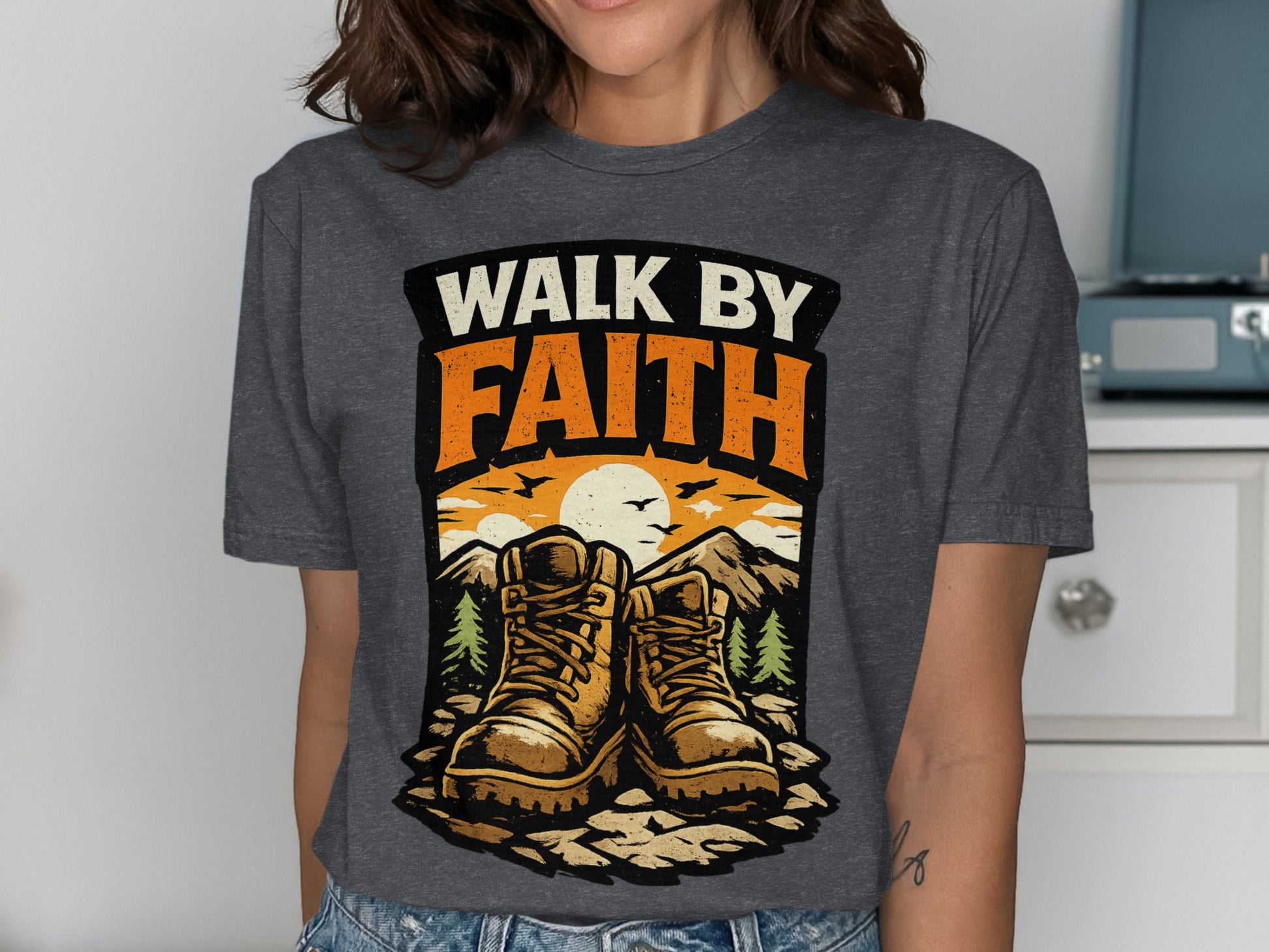 Hiking boots with "Walk by Faith" text and mountain sunset graphic.
