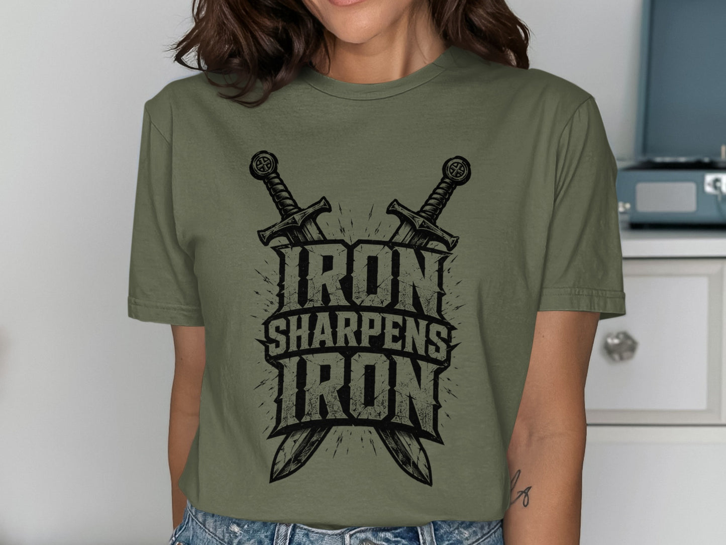 Olive green t-shirt with crossed swords and the text "Iron Sharpens Iron".