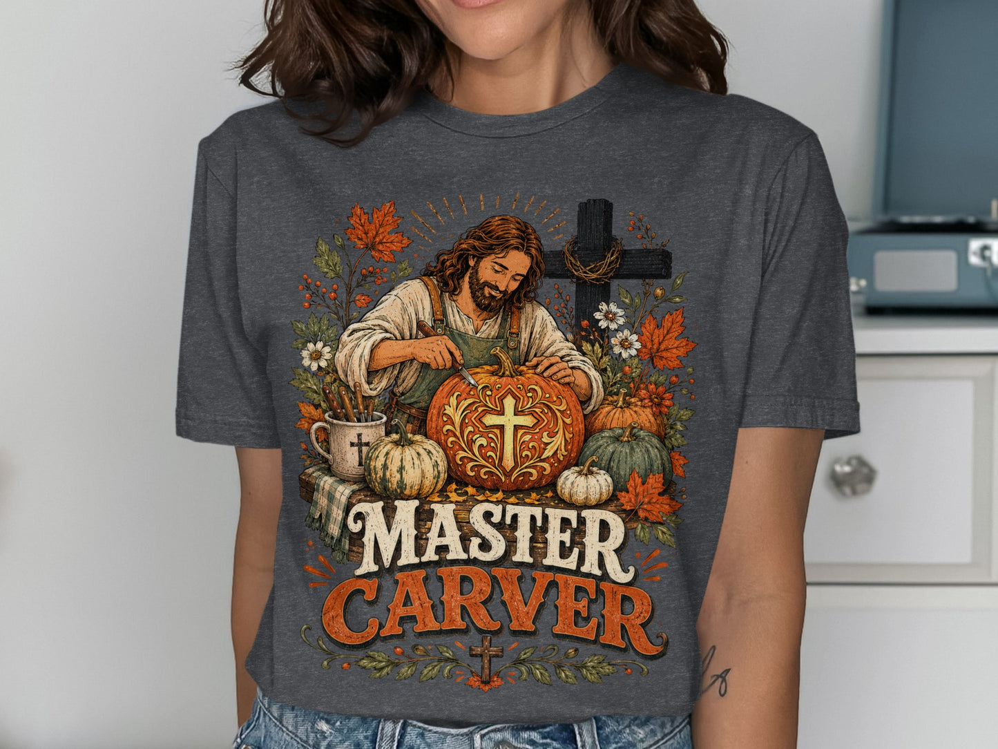 Jesus carving a pumpkin with "Master Carver" text.