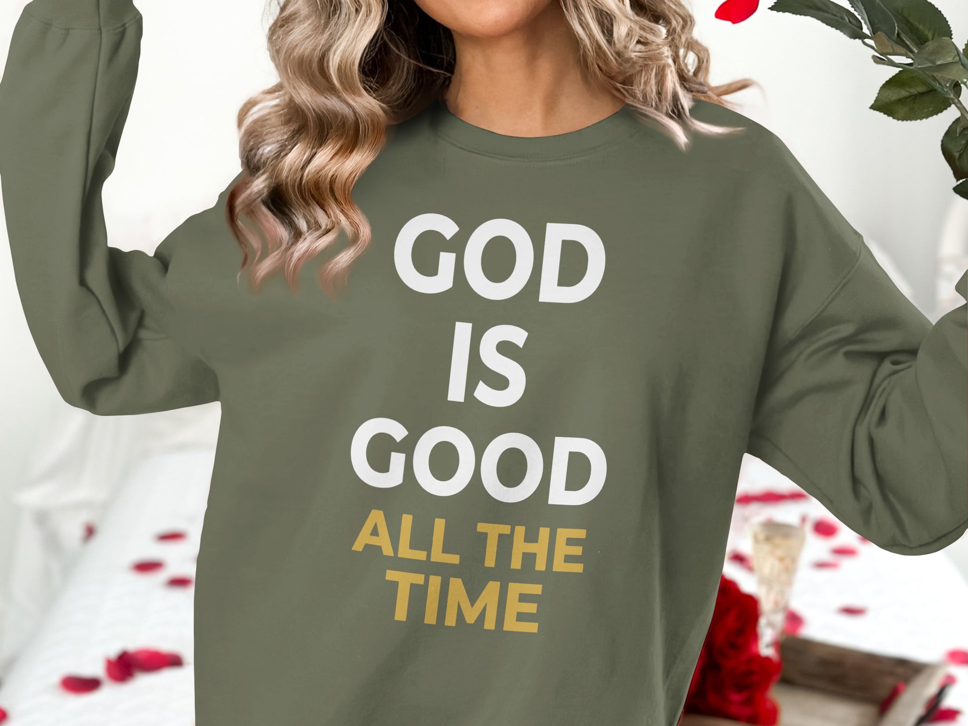 Green sweatshirt with "GOD IS GOOD ALL THE TIME" text in white and yellow.
