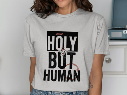 Gray t-shirt with "HOLY BUT HUMAN" text, angel, and red stain.