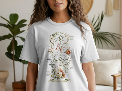 White t-shirt with "All My Life You Have Been Faithful" text and floral design.