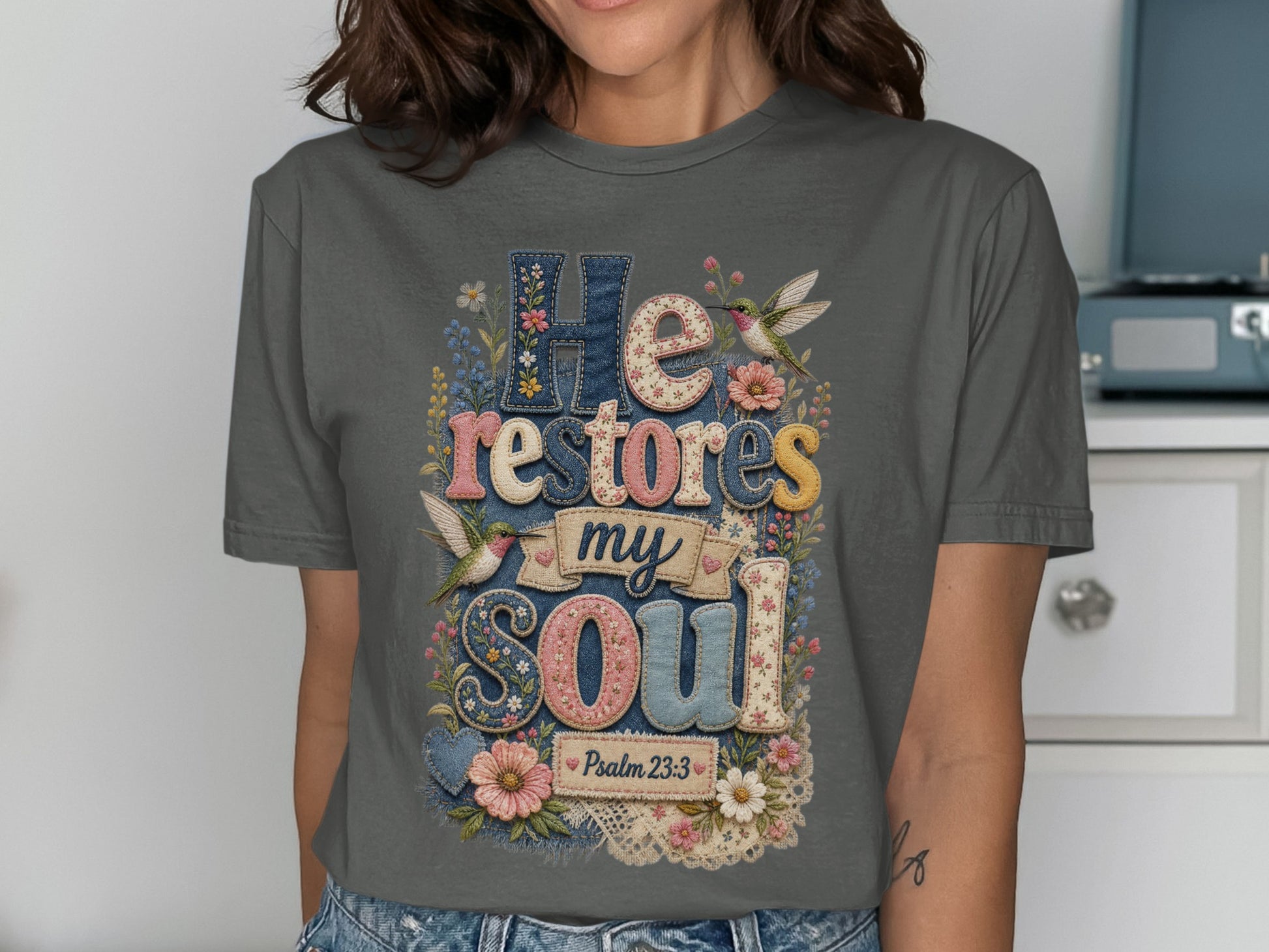 Gray t-shirt with "He restores my soul" and Psalm 23:3.