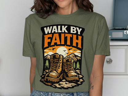 Olive green t-shirt with boots, mountains, and "WALK BY FAITH" text.