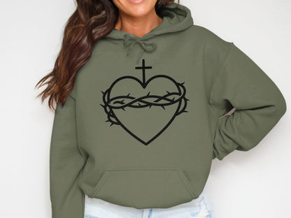 Olive green hoodie featuring a black heart with crown of thorns and cross.