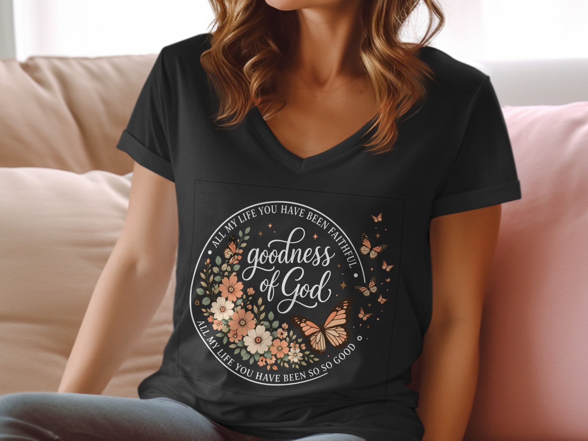 V-neck t-shirt with floral wreath and butterflies, reads "goodness of God."