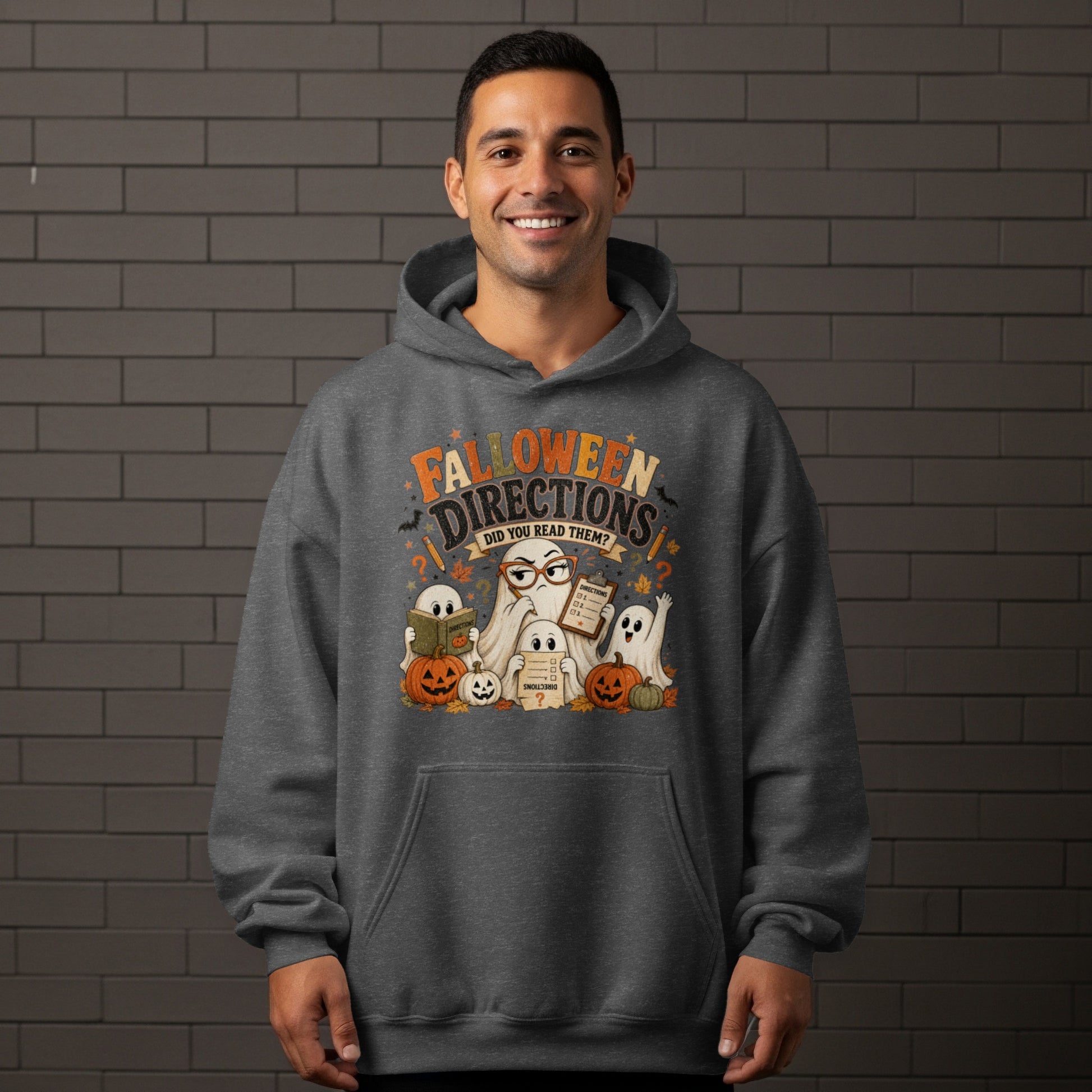 Dark grey hoodie with a graphic of ghosts, pumpkins, and text reading "FALLOWEEN DIRECTIONS DID YOU READ THEM?".