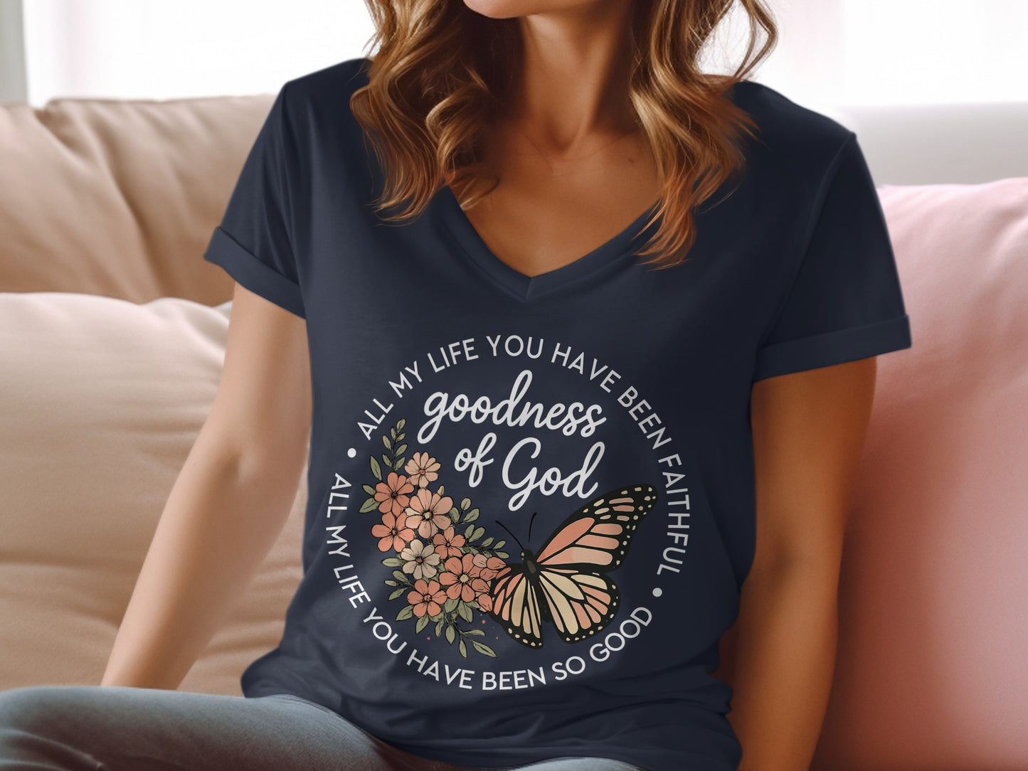 Navy v-neck t-shirt with "goodness of God" and butterfly graphic.