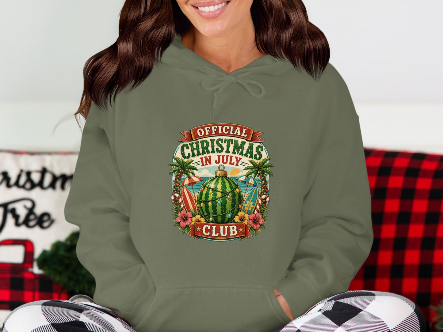 Green hoodie with "Official Christmas in July Club" graphic featuring beach elements.
