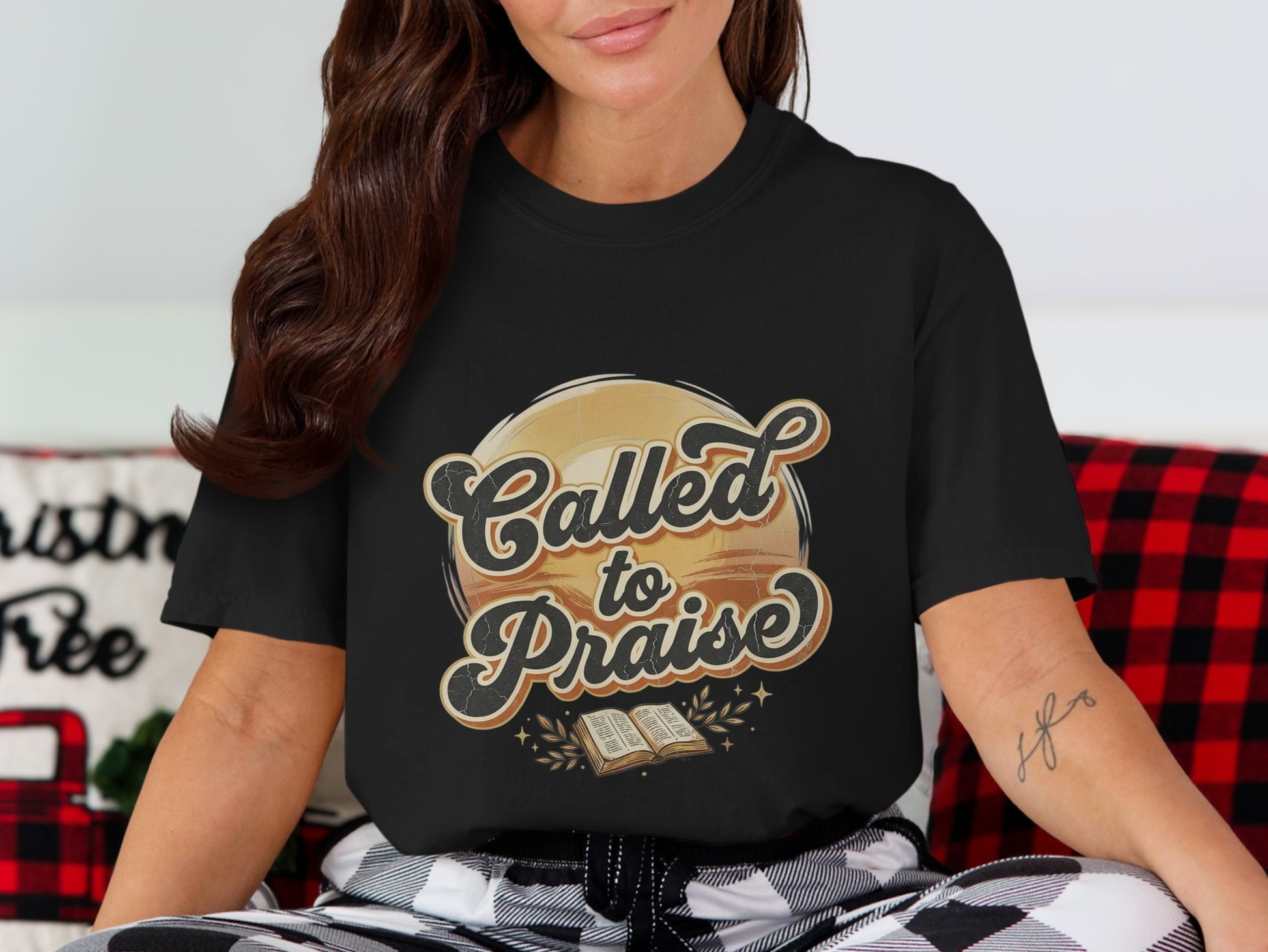 Black T-shirt with "Called to Praise" text and an open book graphic.
