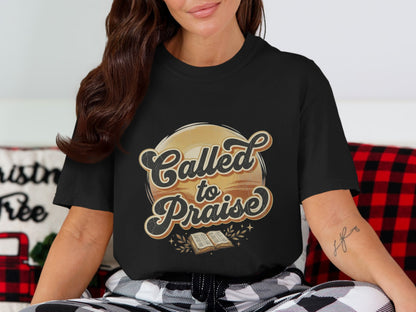 Black T-shirt with "Called to Praise" text and an open book graphic.