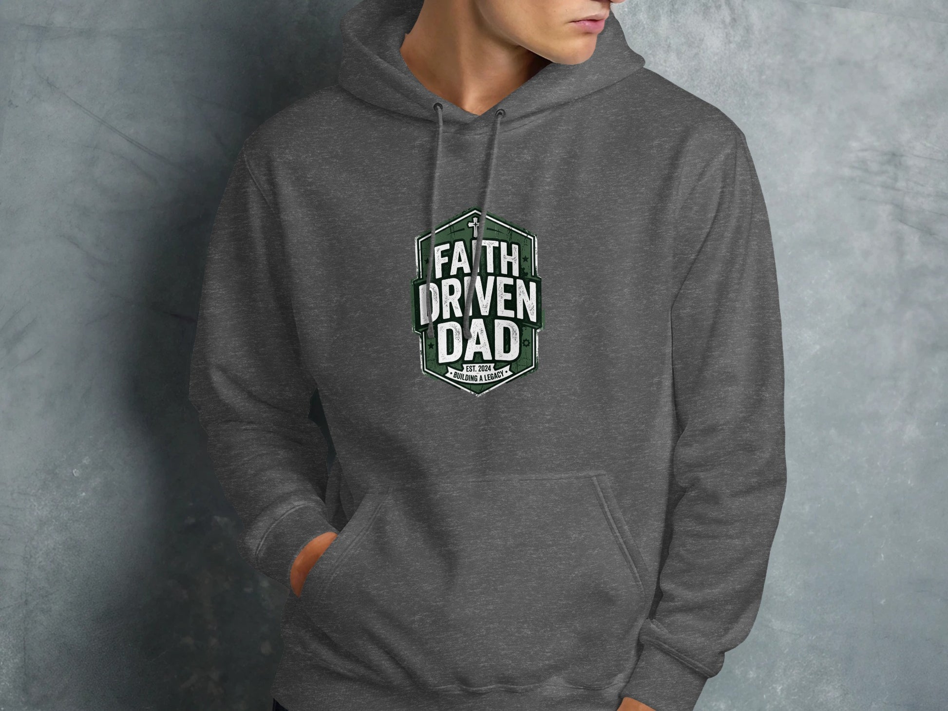 Dark grey hoodie with "Faith Driven Dad" and "Est. 2021" shield logo.